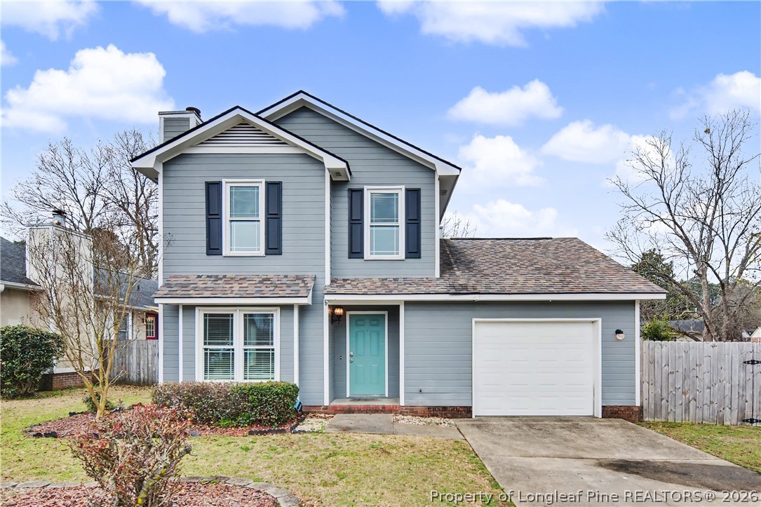 5073 Linton Hall Road Fayetteville, NC 28311 - Photo 1 of 32 a front view of a house with a yard and garage