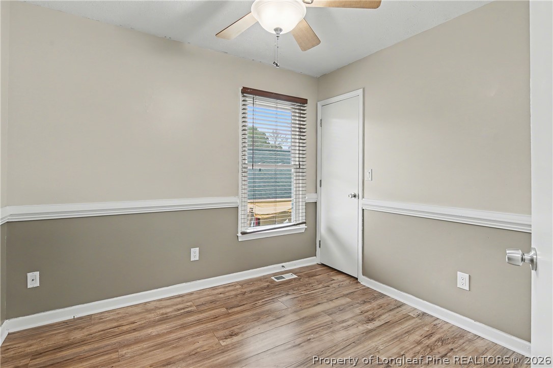 5073 Linton Hall Road Fayetteville, NC 28311 - Photo 26 of 32 a view of an empty room with wooden floor and a window