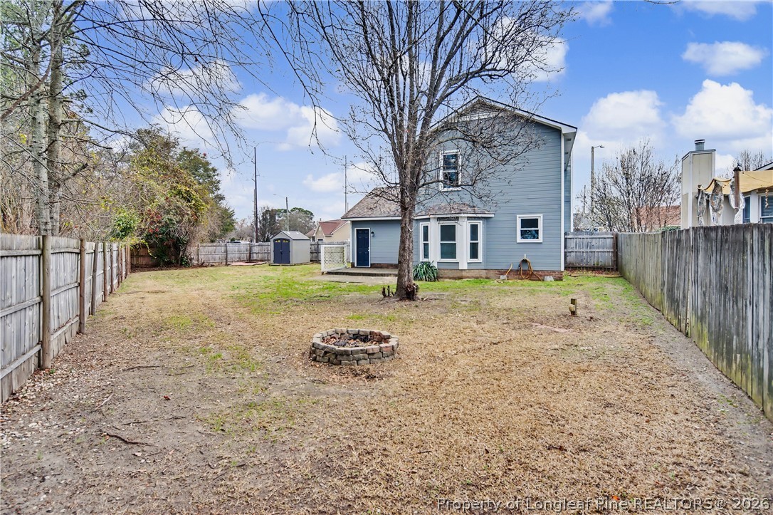 5073 Linton Hall Road Fayetteville, NC 28311 - Photo 29 of 32 a view of a house with a yard