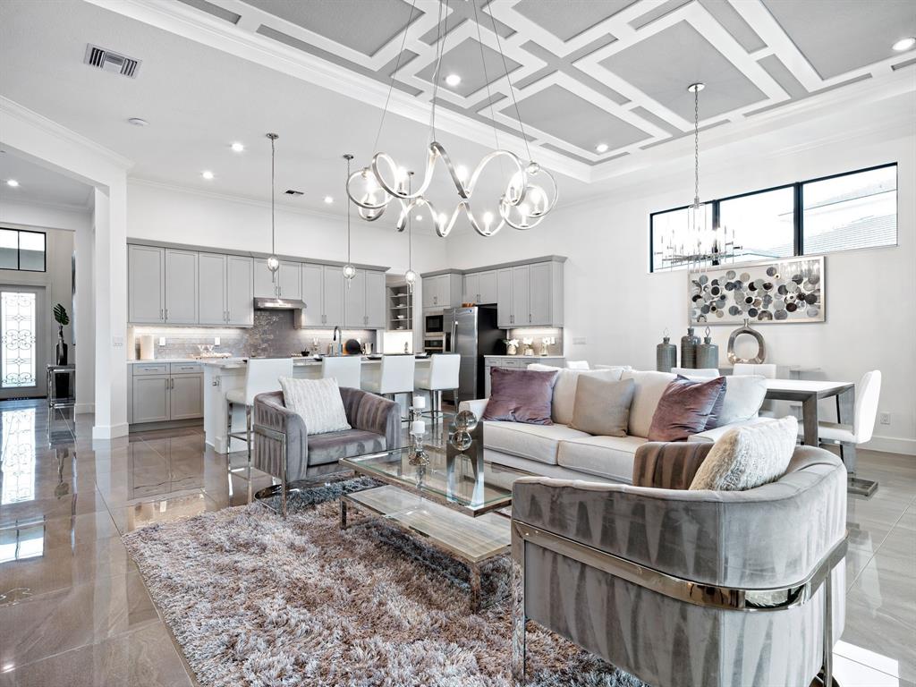 8146 Southwest Vanita Way Port St. Lucie, FL 34987 - Photo 12 of 53 a living room with lots of furniture and kitchen view