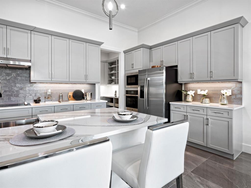 8146 Southwest Vanita Way Port St. Lucie, FL 34987 - Photo 18 of 53 a kitchen with stainless steel appliances granite countertop a sink stove and refrigerator