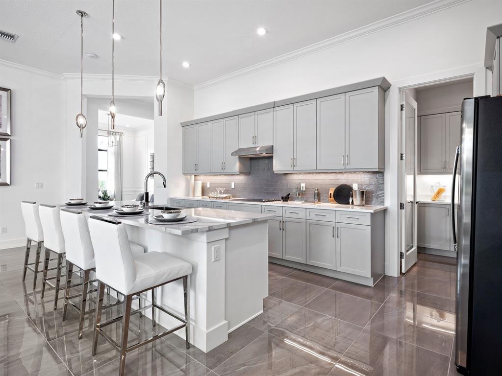 8146 Southwest Vanita Way Port St. Lucie, FL 34987 - Photo 19 of 53 a kitchen with a sink cabinets and window