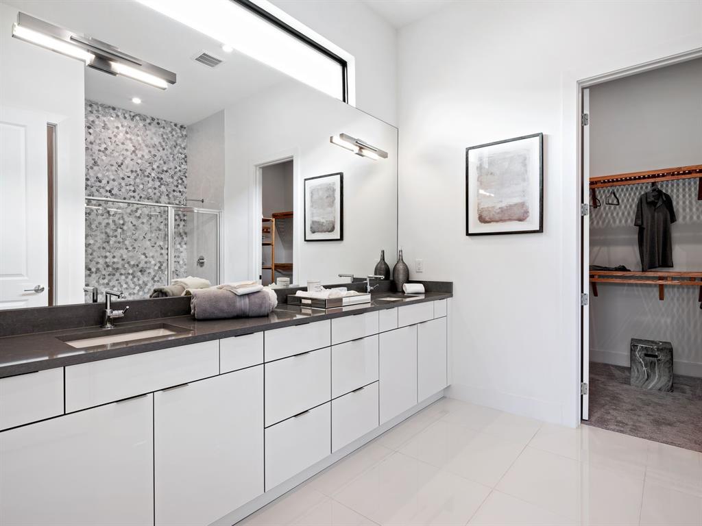 8146 Southwest Vanita Way Port St. Lucie, FL 34987 - Photo 24 of 53 a bathroom with double sink and a mirror