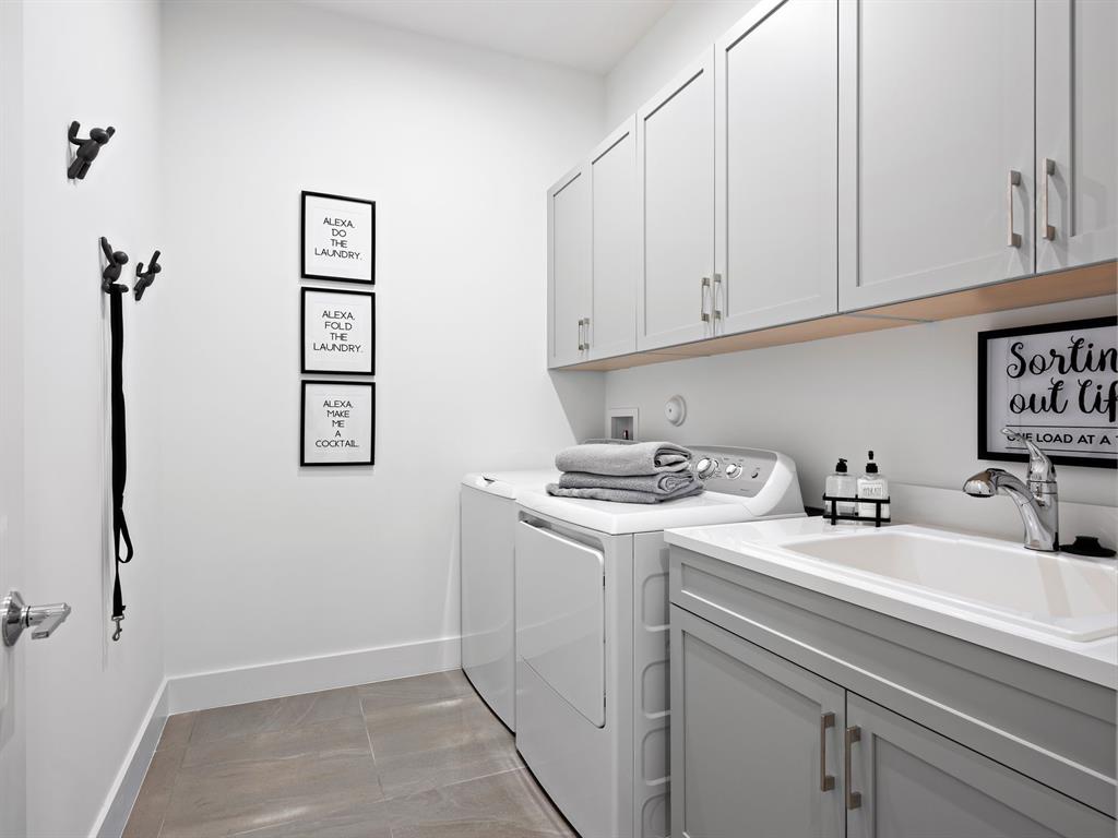 8146 Southwest Vanita Way Port St. Lucie, FL 34987 - Photo 28 of 53 a view of a kitchen with sink and washing machine