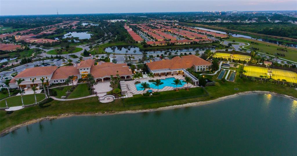 8146 Southwest Vanita Way Port St. Lucie, FL 34987 - Photo 29 of 53 an aerial view of a house with a garden and lake view