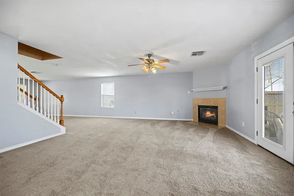 a kitchen with granite countertop a sink cabinets stainless steel appliances and a counter top space