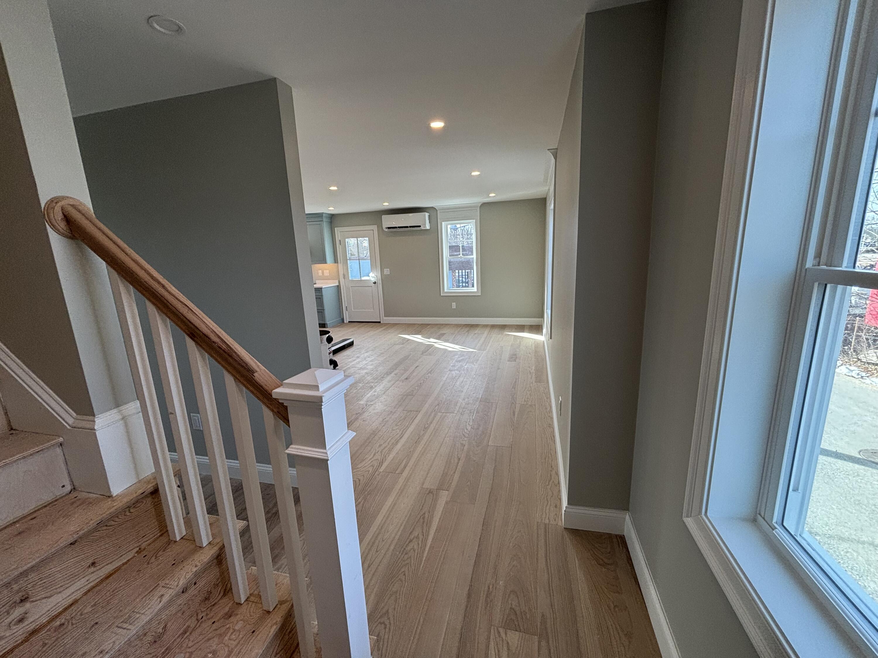 46 B Holt Road Bourne, MA 02532 - Photo 9 of 14 a view of a hallway with wooden floor and staircase