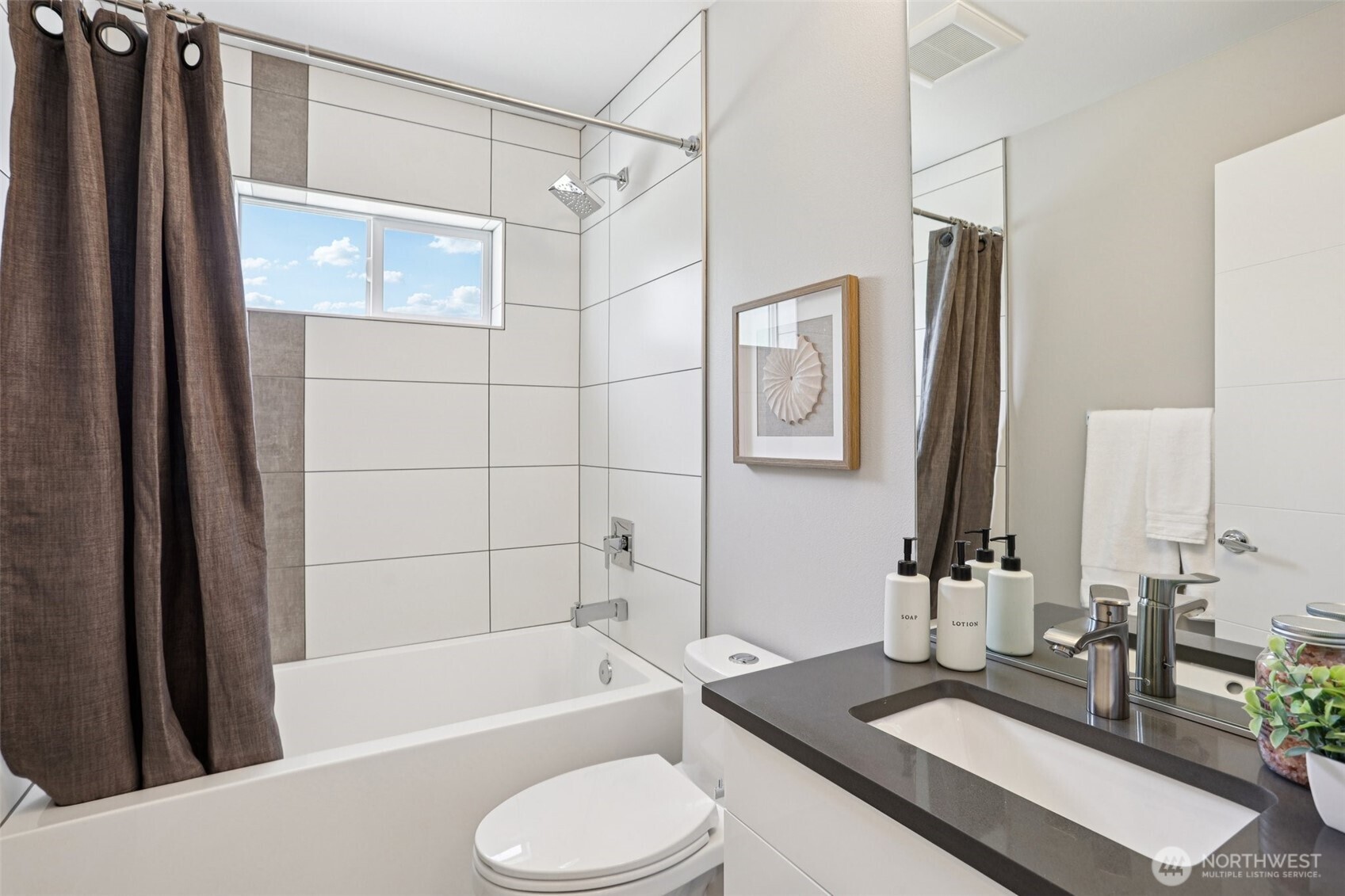 5017 Delridge Way Southwest, Unit A Seattle, WA 98106 - Photo 16 of 26 a bathroom with a granite countertop sink toilet and shower
