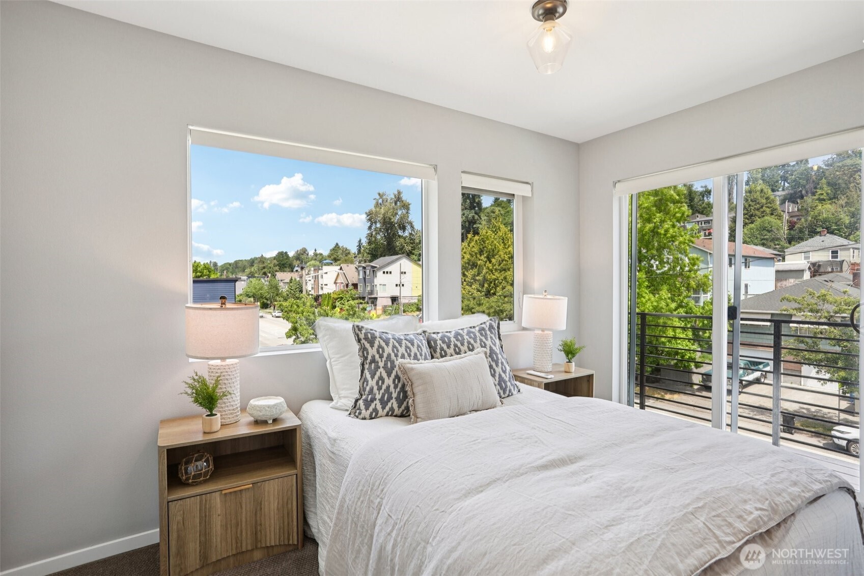 5017 Delridge Way Southwest, Unit A Seattle, WA 98106 - Photo 17 of 26 a bedroom with a bed and a window