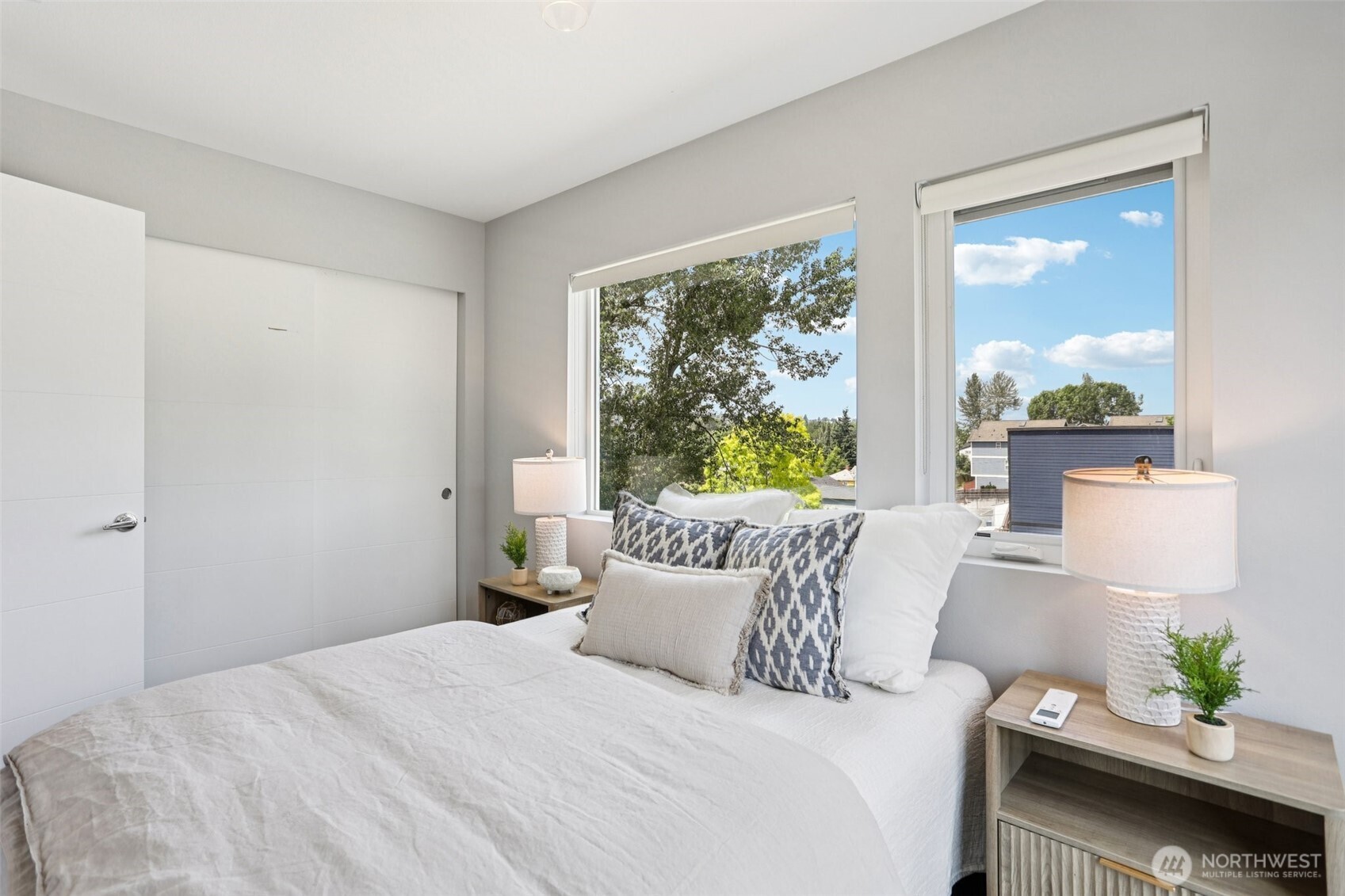 5017 Delridge Way Southwest, Unit A Seattle, WA 98106 - Photo 19 of 26 a bedroom with a bed and window