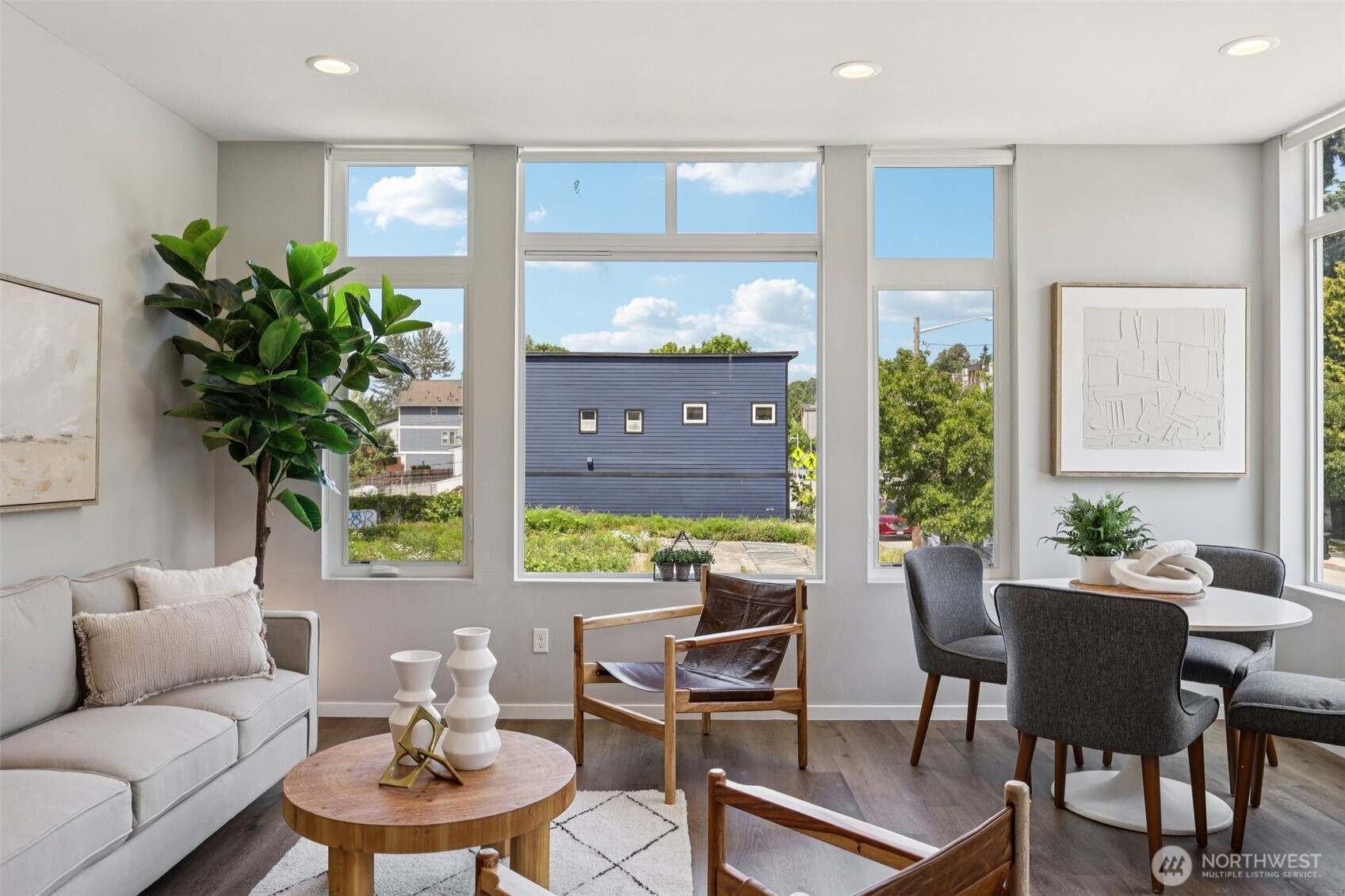 5017 Delridge Way Southwest, Unit A Seattle, WA 98106 - Photo 5 of 26 a living room with furniture potted plant and a large window