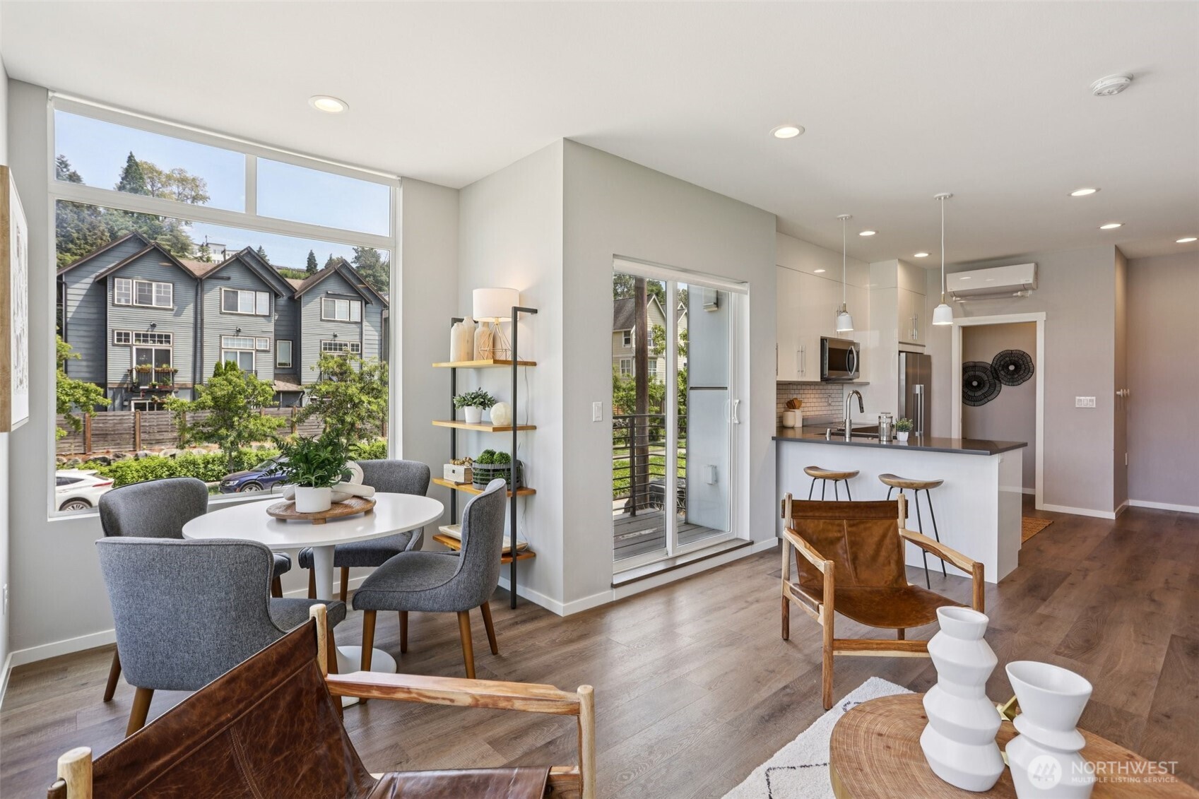 5017 Delridge Way Southwest, Unit A Seattle, WA 98106 - Photo 7 of 26 a view of a dining room with furniture window and wooden floor