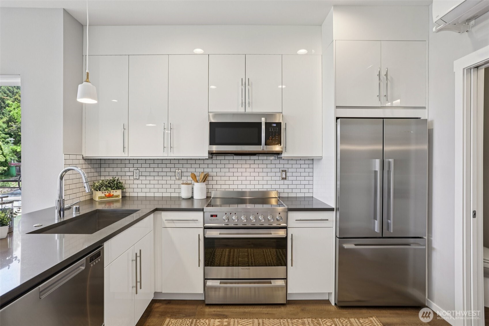 5017 Delridge Way Southwest, Unit A Seattle, WA 98106 - Photo 10 of 26 a kitchen with cabinets stainless steel appliances and sink