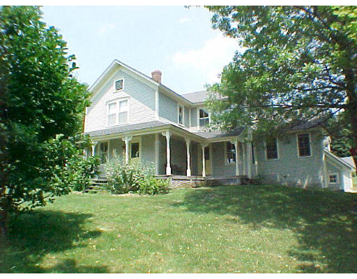130 Old Post Road Worthington, MA 01098 - Photo 1 of 6 a front view of a house with garden