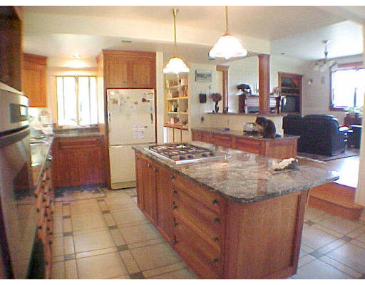 130 Old Post Road Worthington, MA 01098 - Photo 5 of 6 a kitchen with granite countertop a stove a sink dishwasher and a refrigerator