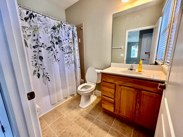 a bathroom with a double vanity sink and mirror