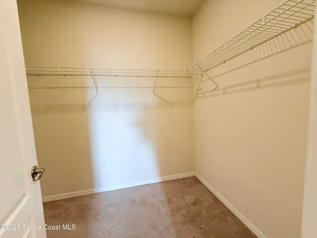 a view of a lake with houses in the back