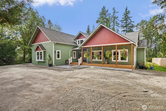 a view of a house with a yard and garage