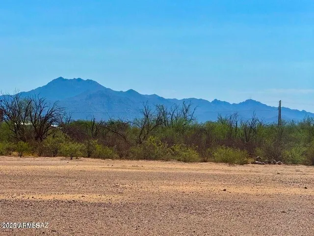 a view of mountain and a yard