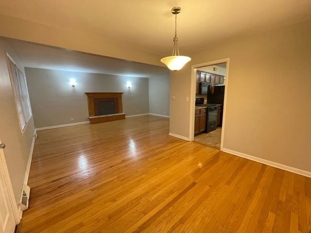 1424 Willow Road Homewood, IL 60430 - Photo 5 of 17 a view of empty room with wooden floor