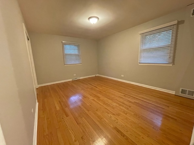 1424 Willow Road Homewood, IL 60430 - Photo 6 of 17 a view of an empty room with wooden floor