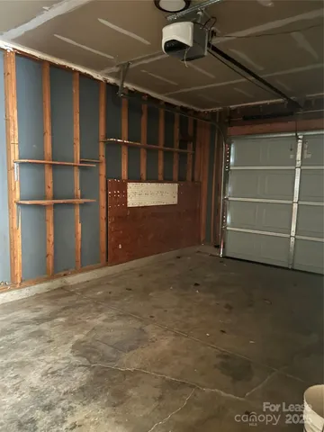 a view of an empty room with empty shelves