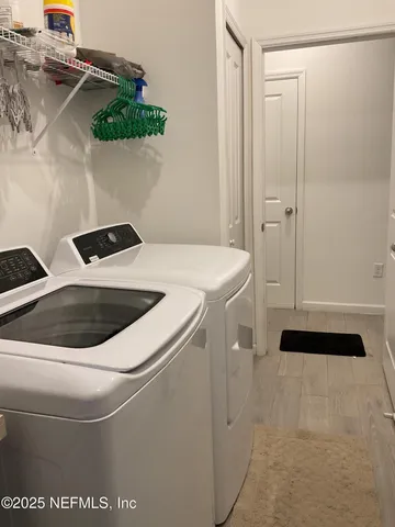 a utility room with dryer and washer