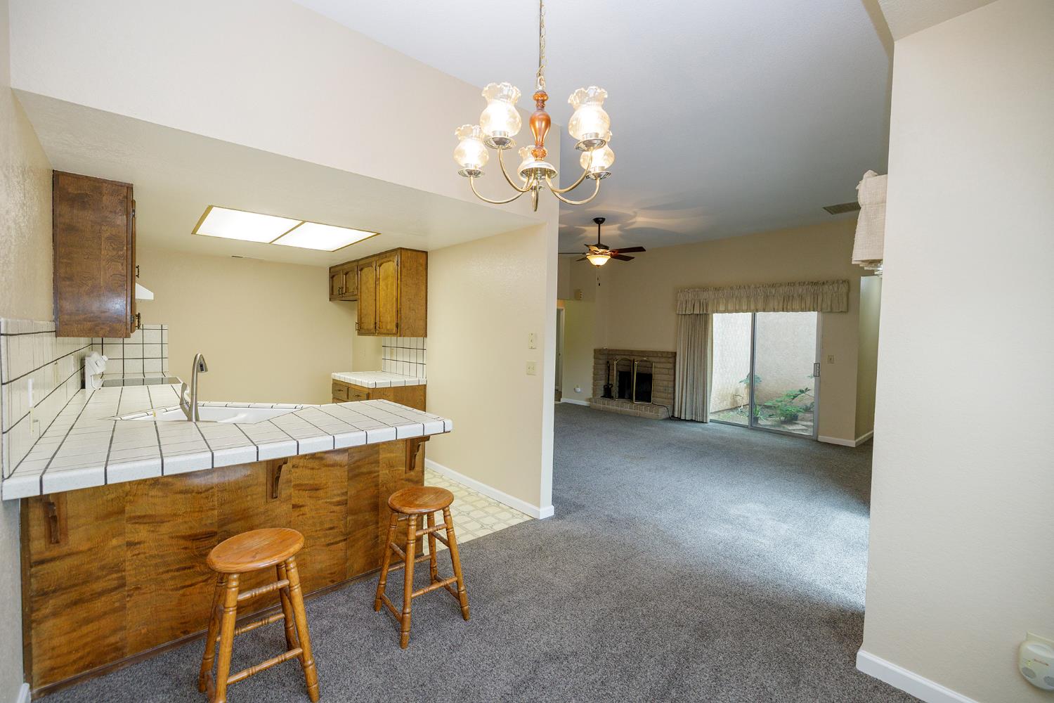 1124 Tasmania Way Modesto, CA 95356 - Photo 15 of 34 a view of a dining room with furniture and a chandelier