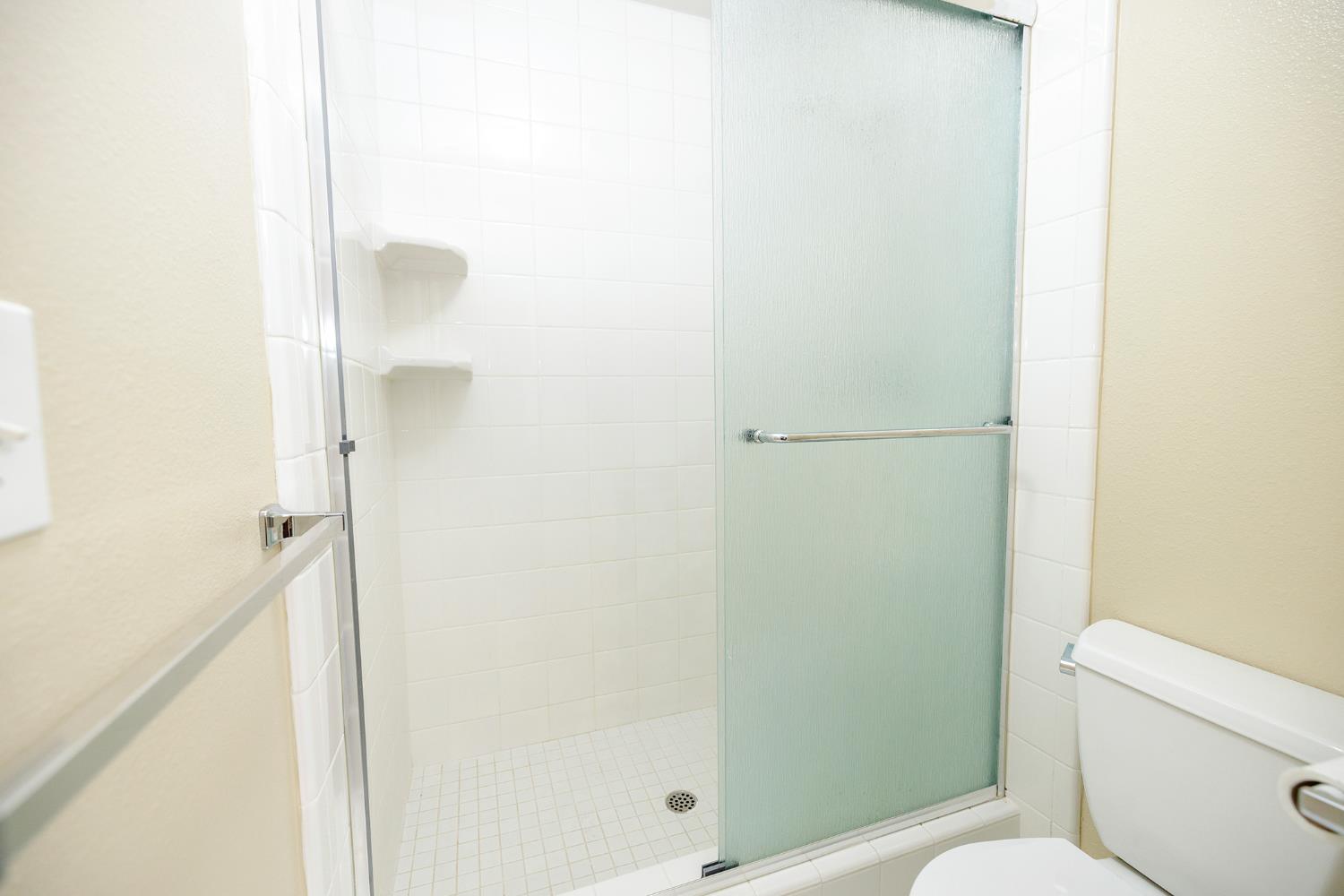 1124 Tasmania Way Modesto, CA 95356 - Photo 26 of 34 a bathroom with a shower and a toilet