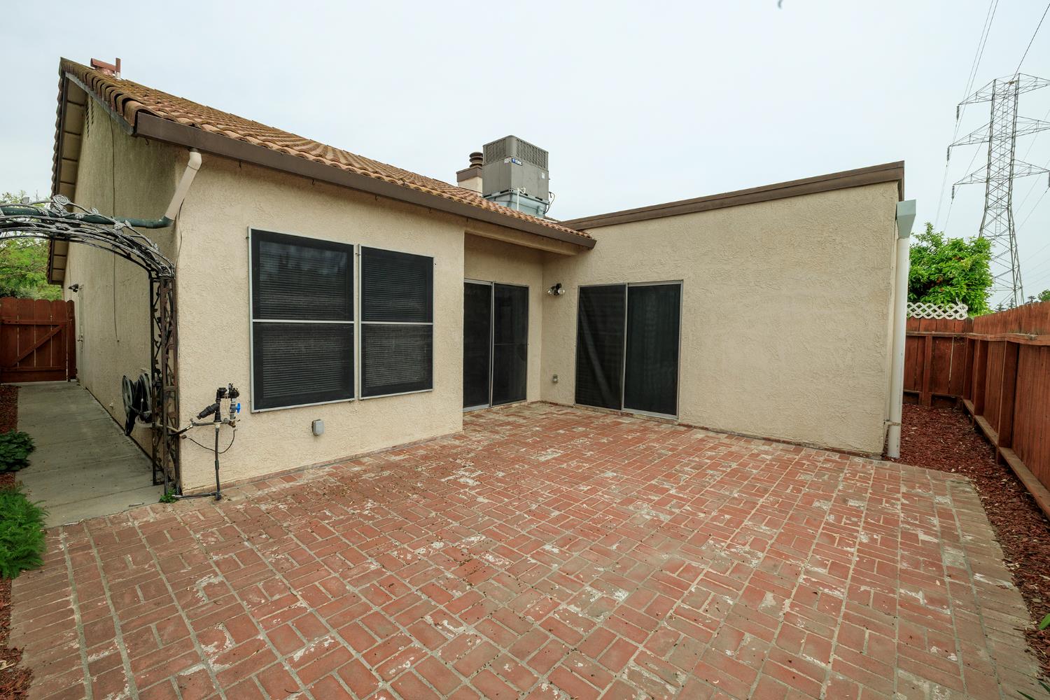 1124 Tasmania Way Modesto, CA 95356 - Photo 32 of 34 a view of a house with a large window