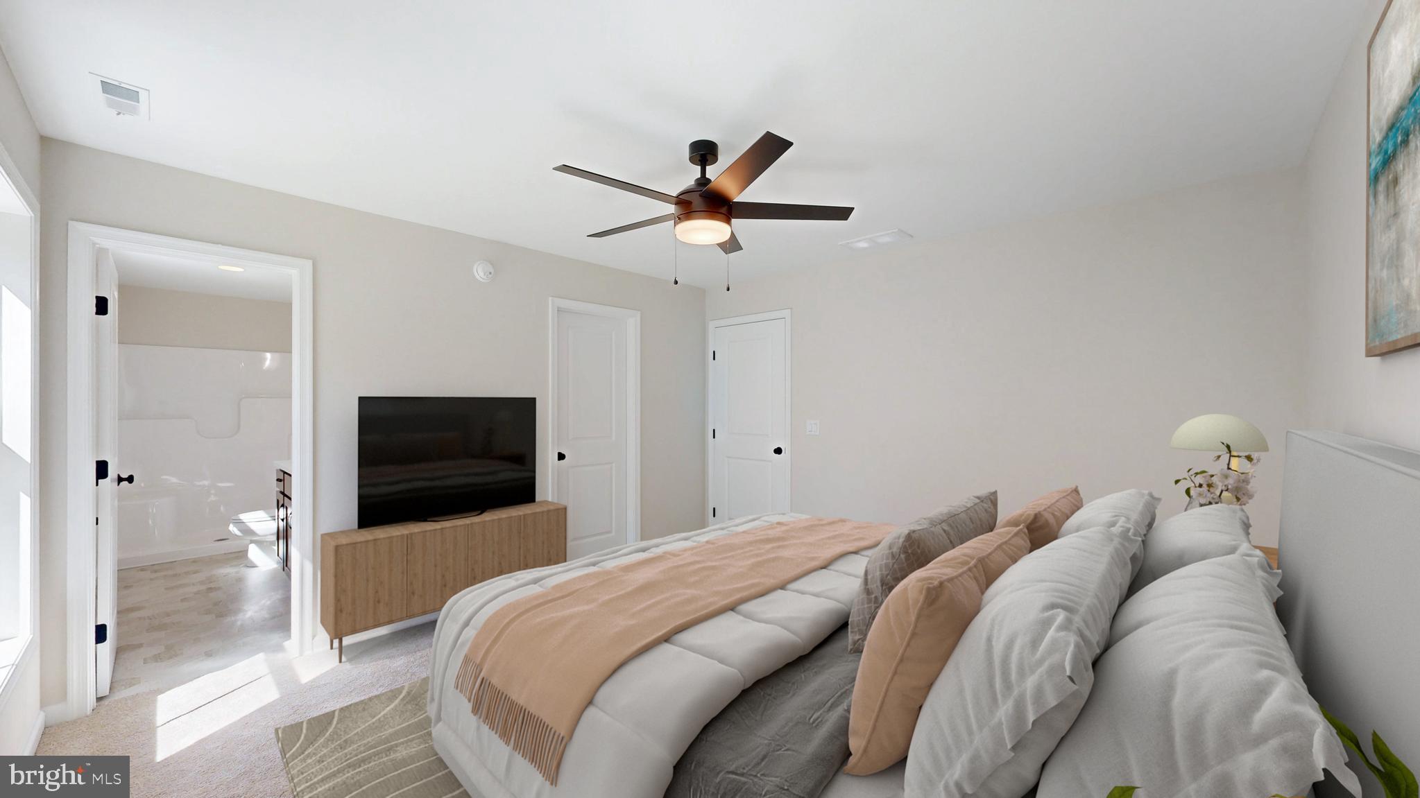 99 Cooper Street Kenton, DE 19938 - Photo 13 of 43 a bedroom with a bed and a chandelier