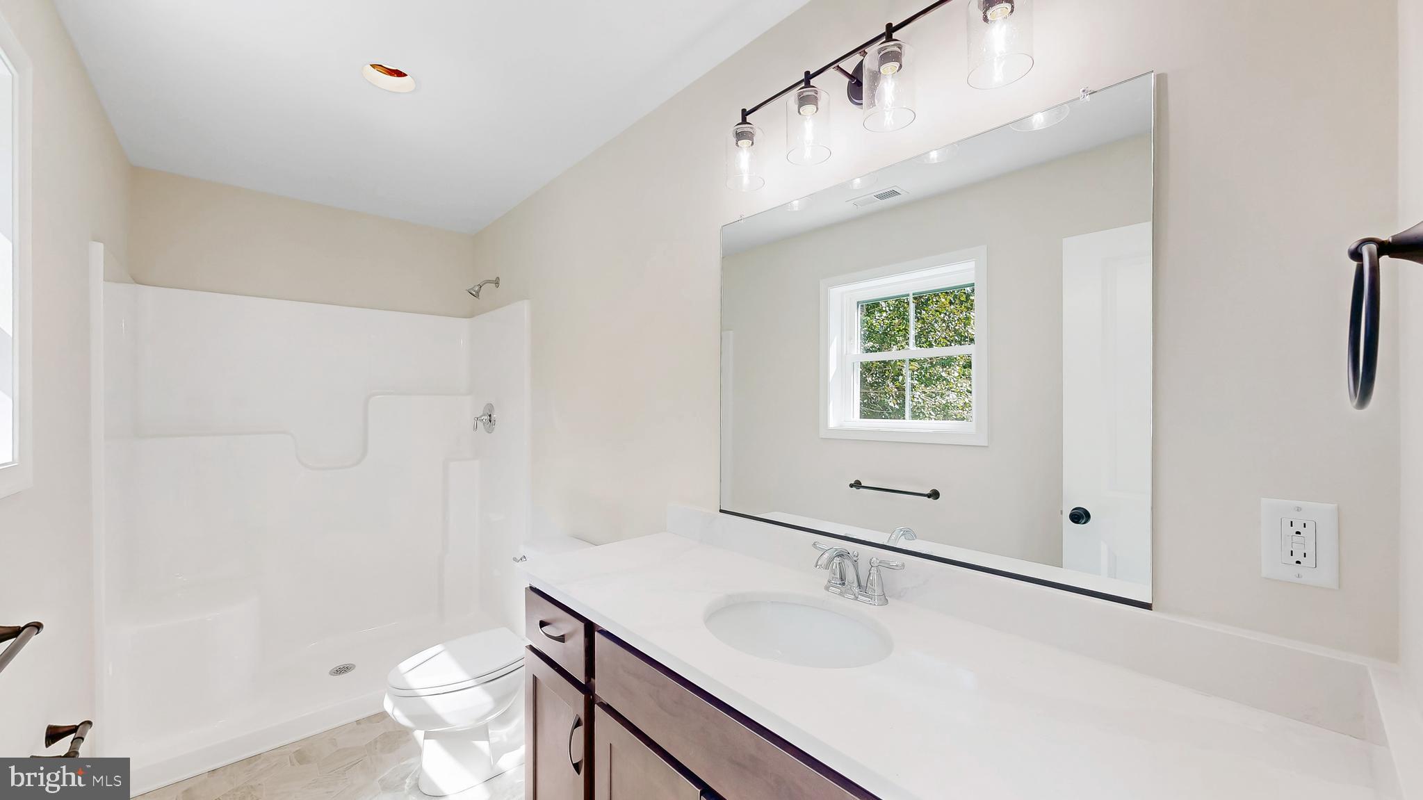 99 Cooper Street Kenton, DE 19938 - Photo 19 of 43 a bathroom with a sink toilet vanity and granite