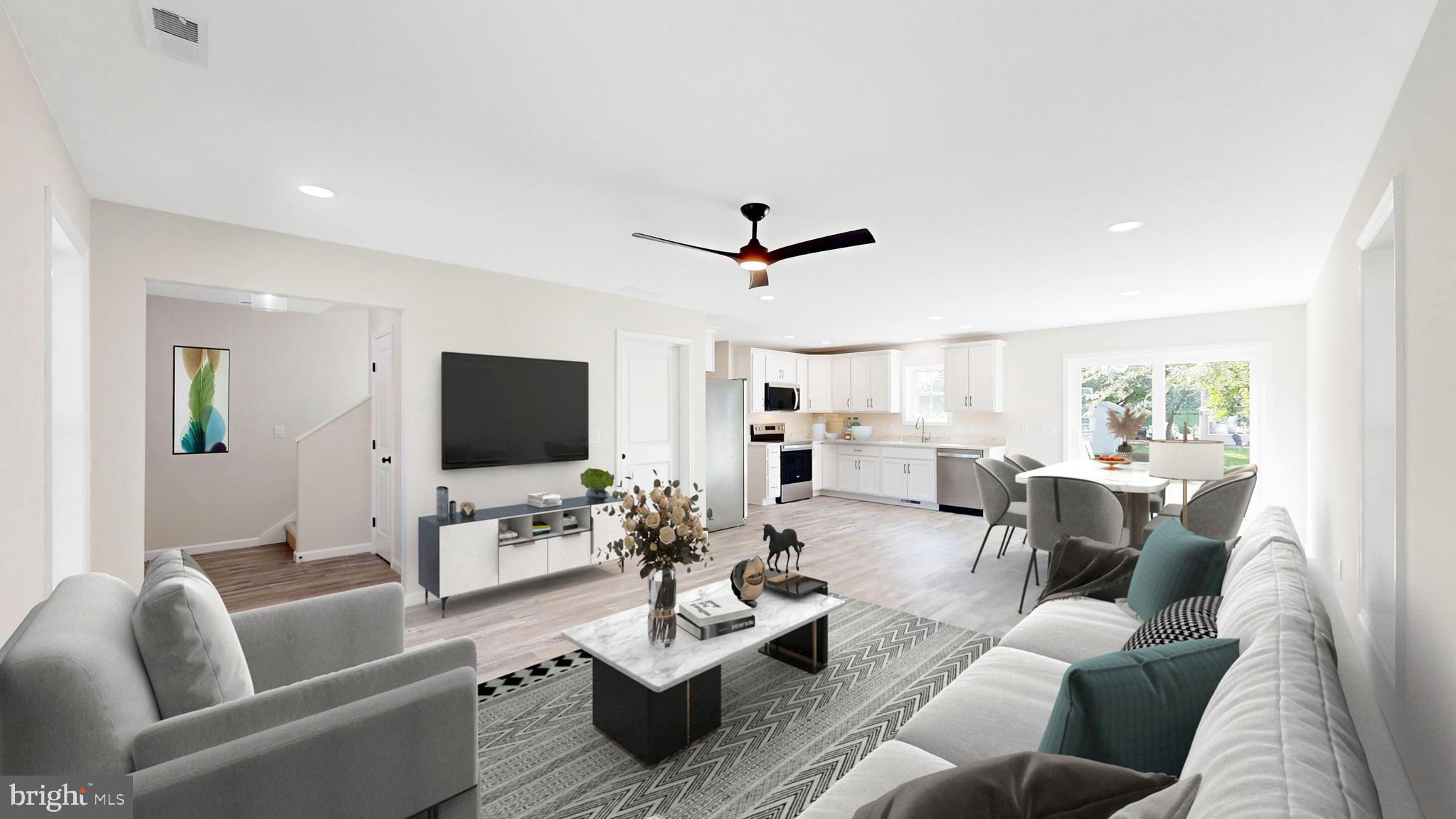 99 Cooper Street Kenton, DE 19938 - Photo 2 of 43 a living room with furniture flat screen tv and a large window