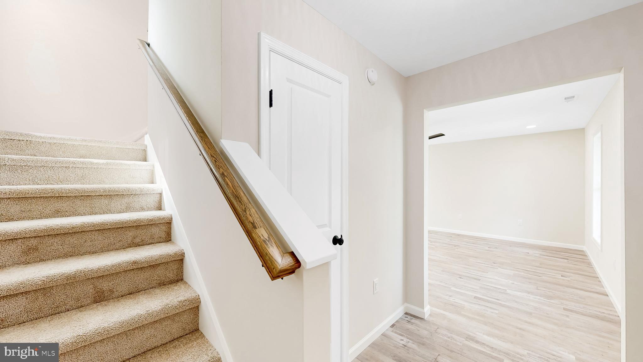 99 Cooper Street Kenton, DE 19938 - Photo 27 of 43 a view of staircase with white walls and white door