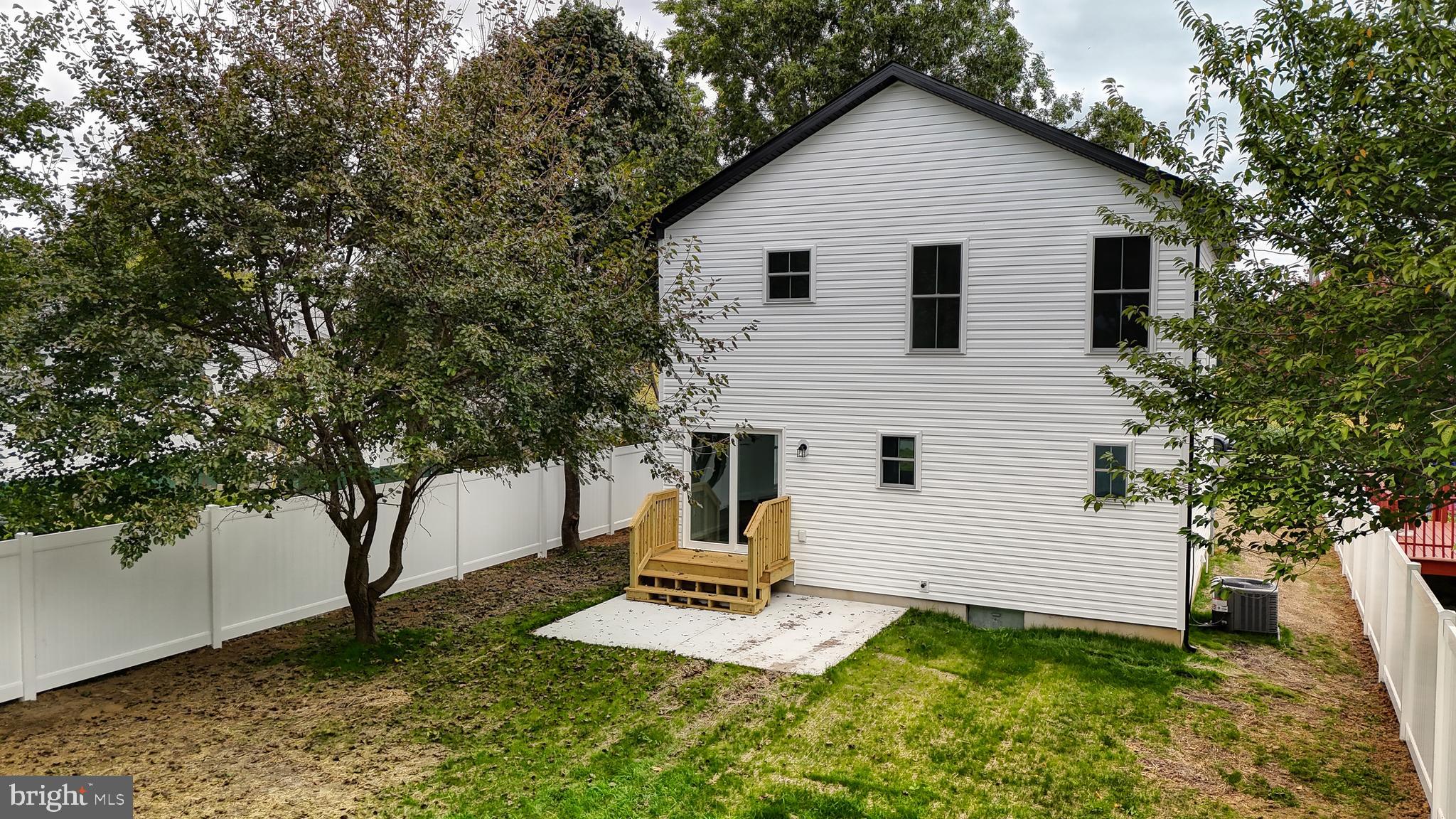 99 Cooper Street Kenton, DE 19938 - Photo 30 of 43 a view of a house with a yard