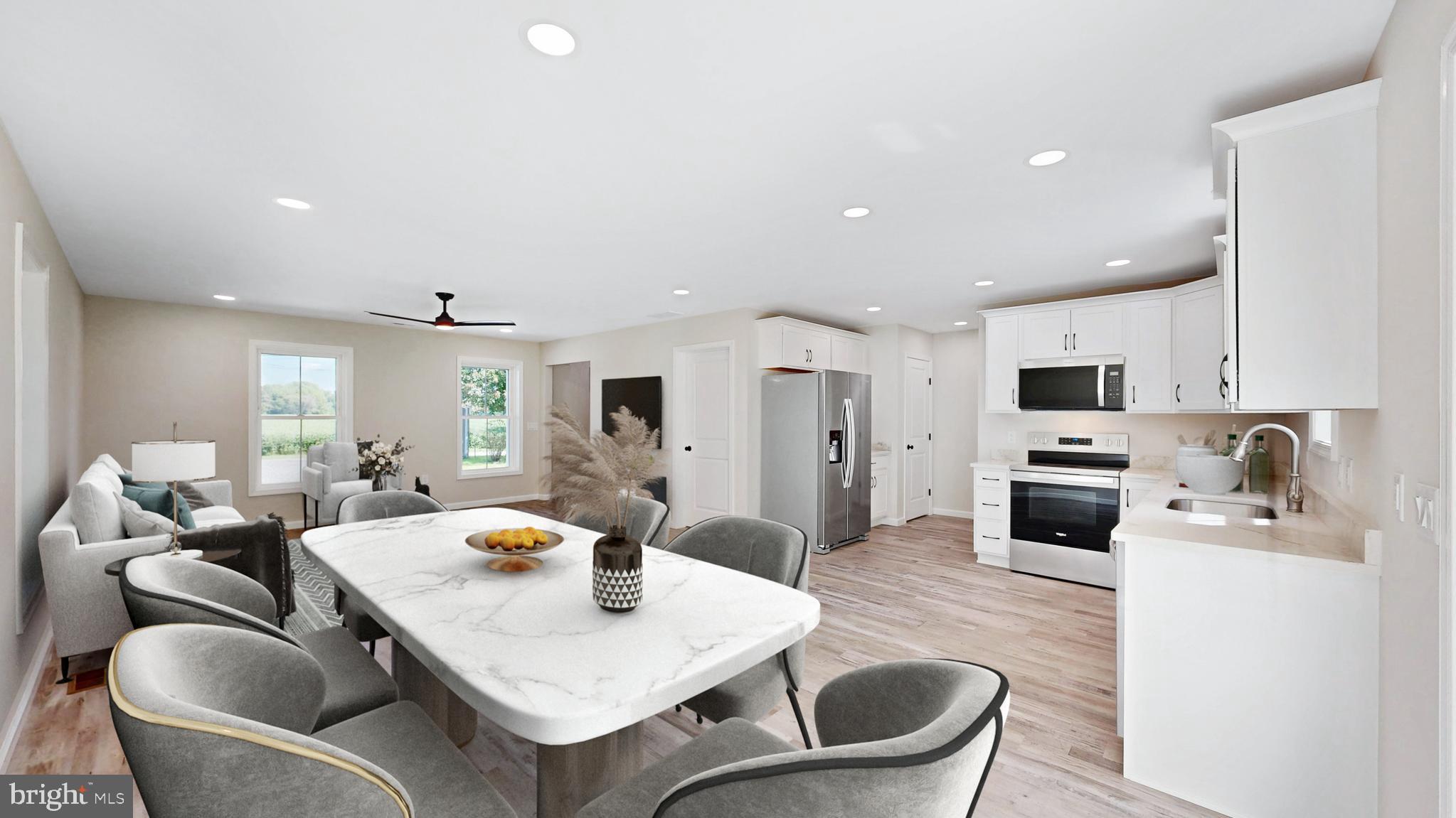 99 Cooper Street Kenton, DE 19938 - Photo 4 of 43 a large kitchen with a table and chairs