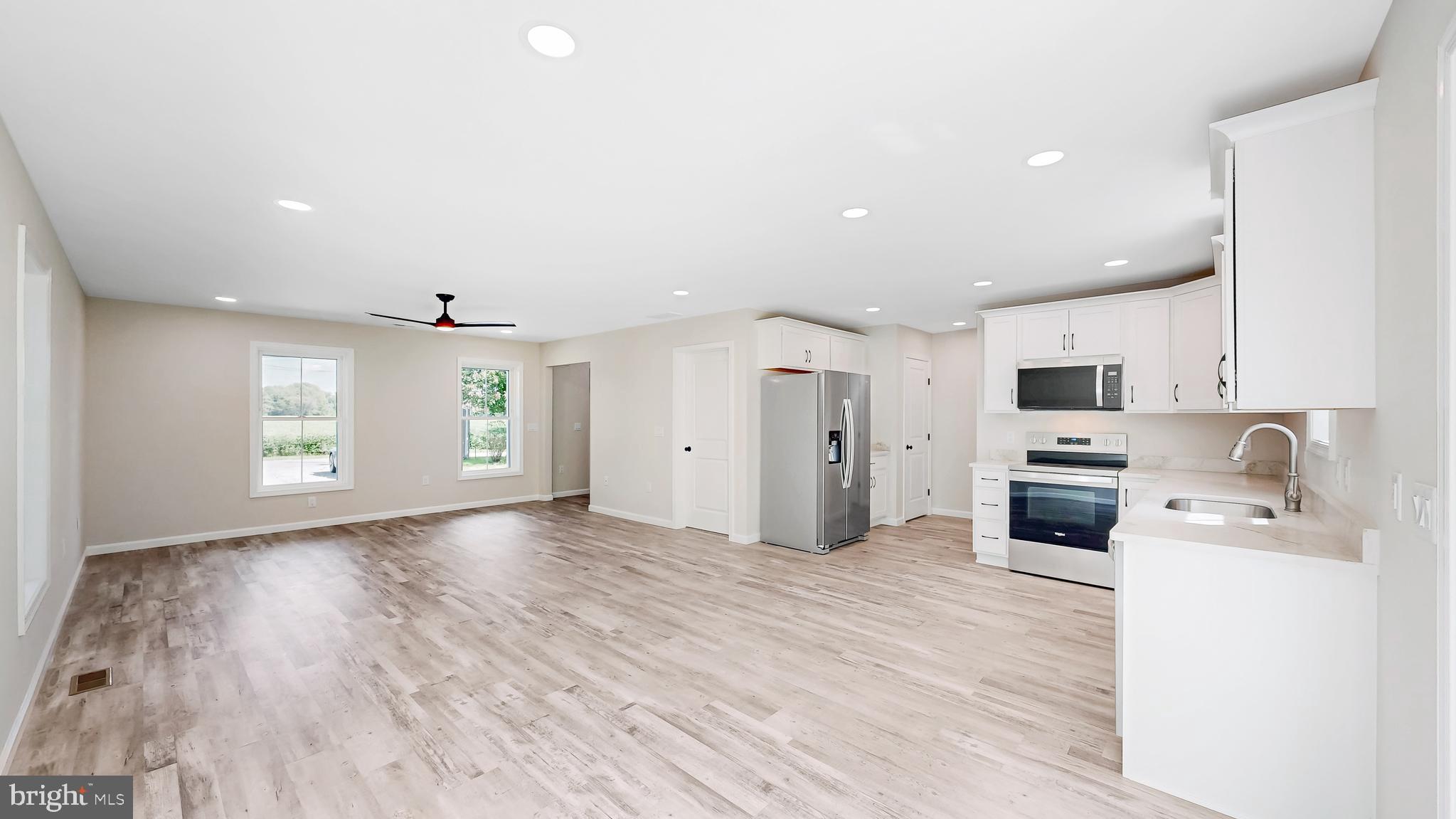99 Cooper Street Kenton, DE 19938 - Photo 7 of 43 a view of a kitchen with microwave and cabinets
