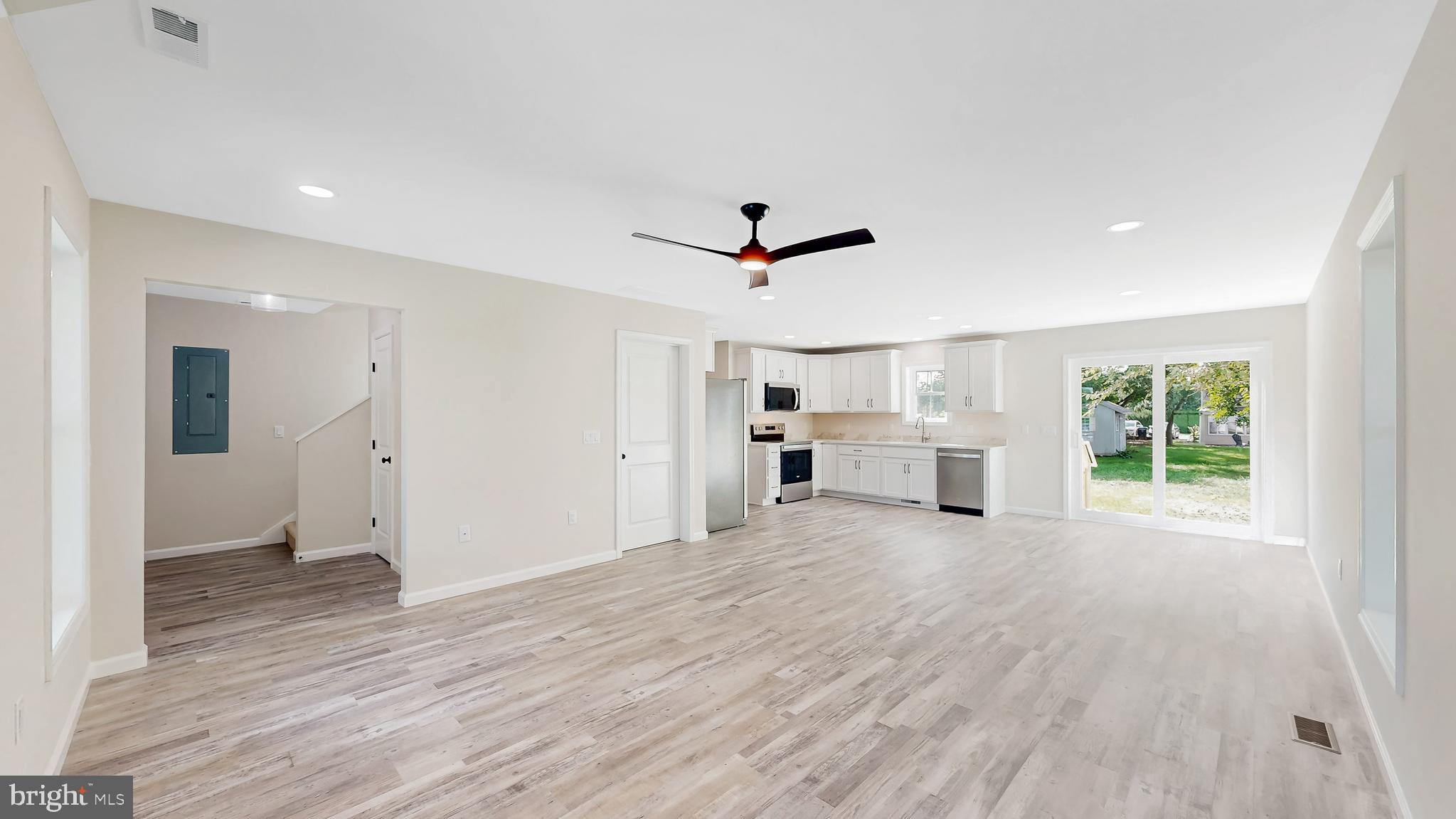 99 Cooper Street Kenton, DE 19938 - Photo 10 of 43 a view of a livingroom with wooden floor and a ceiling fan