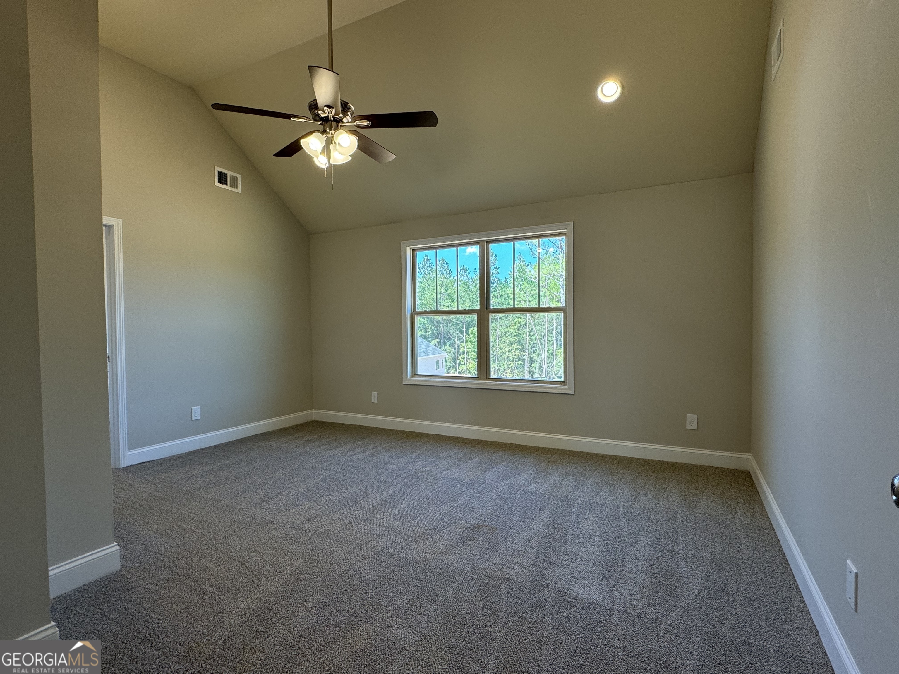 166 Country World Drive Macon, GA 31211 - Photo 13 of 33 an empty room with windows and fan