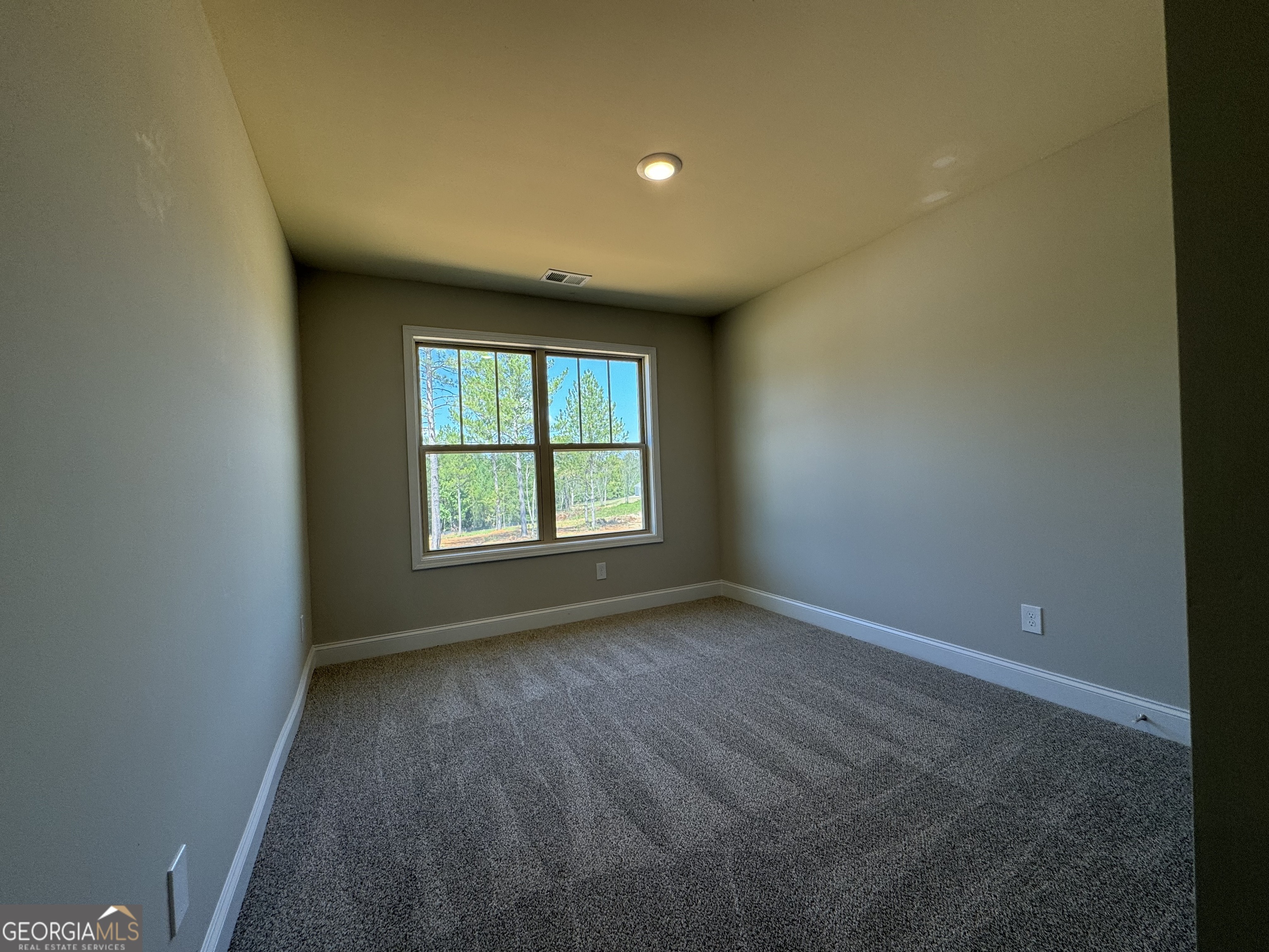 166 Country World Drive Macon, GA 31211 - Photo 15 of 33 an empty room with a window