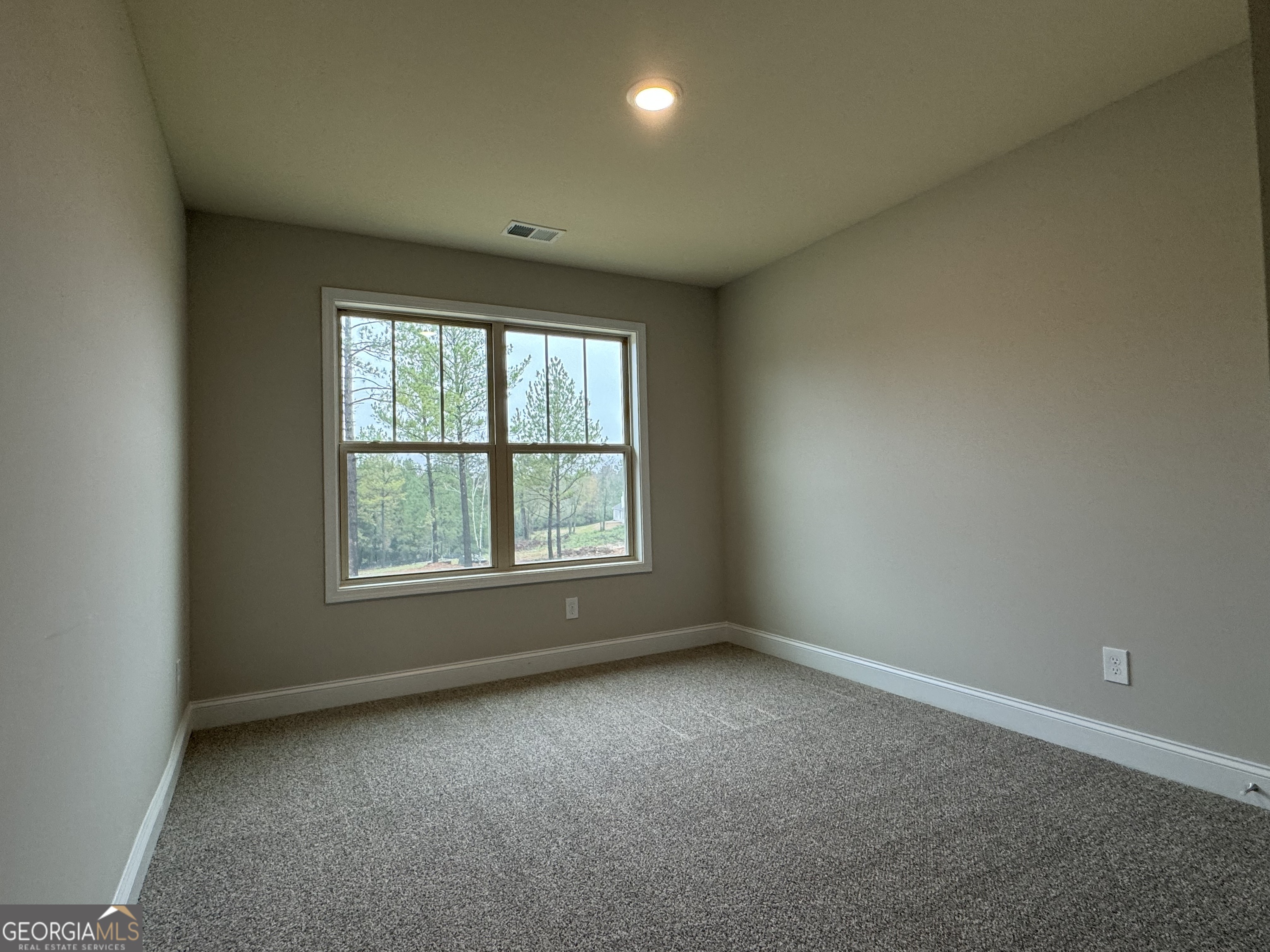 166 Country World Drive Macon, GA 31211 - Photo 22 of 33 an empty room with a window