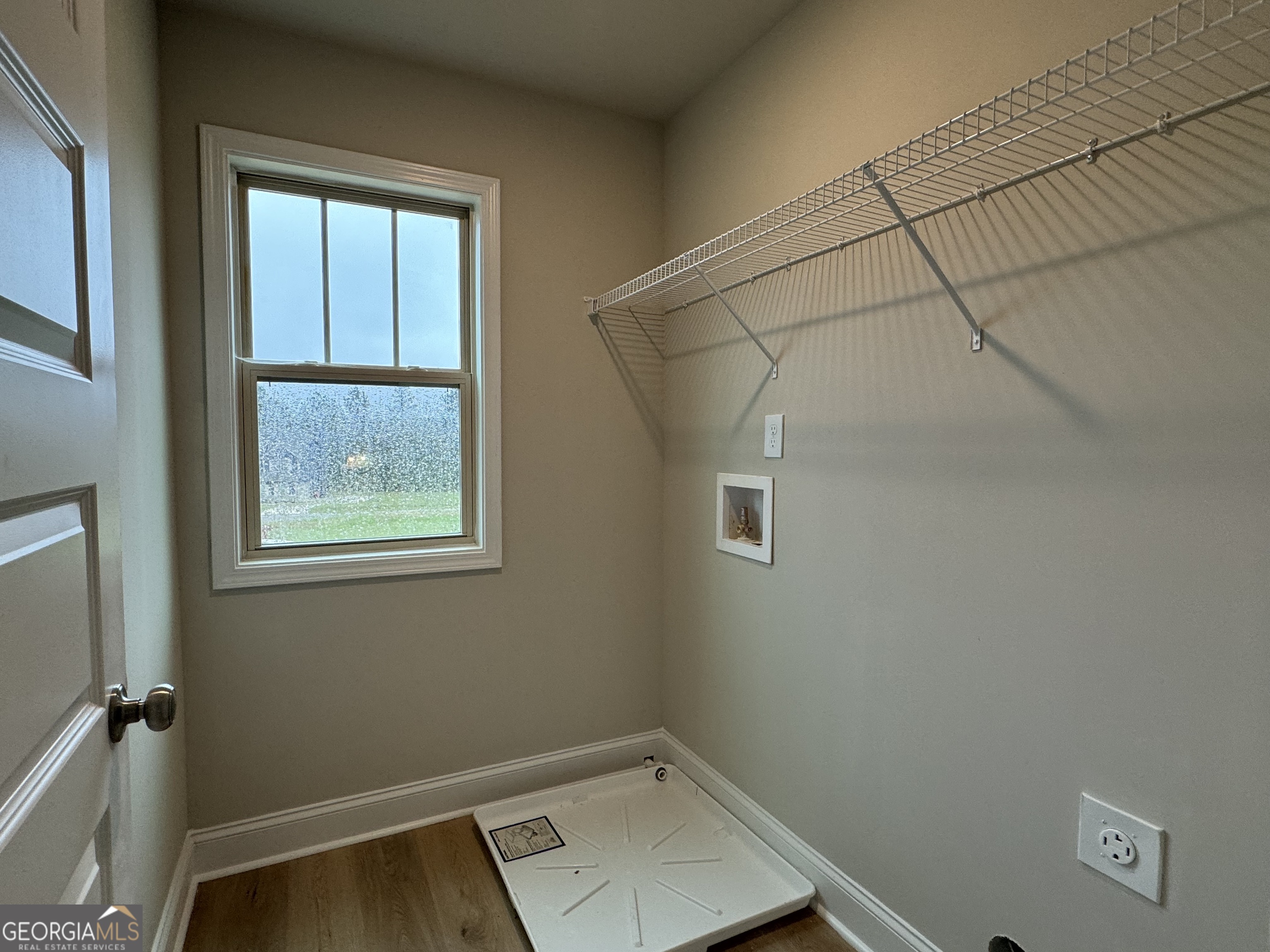 166 Country World Drive Macon, GA 31211 - Photo 24 of 33 a view of a room with rack on the wall and a window