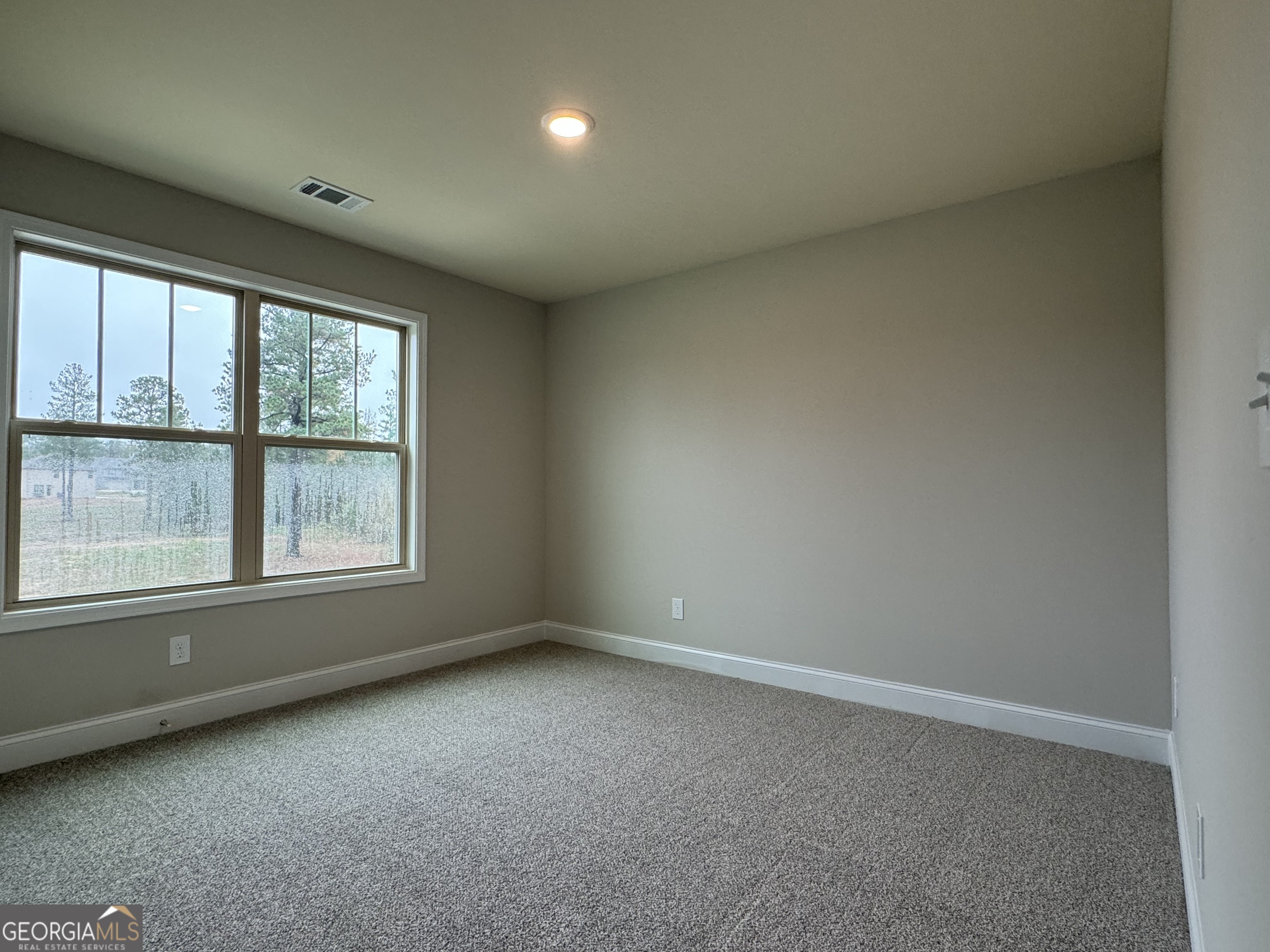 166 Country World Drive Macon, GA 31211 - Photo 27 of 33 an empty room with a window