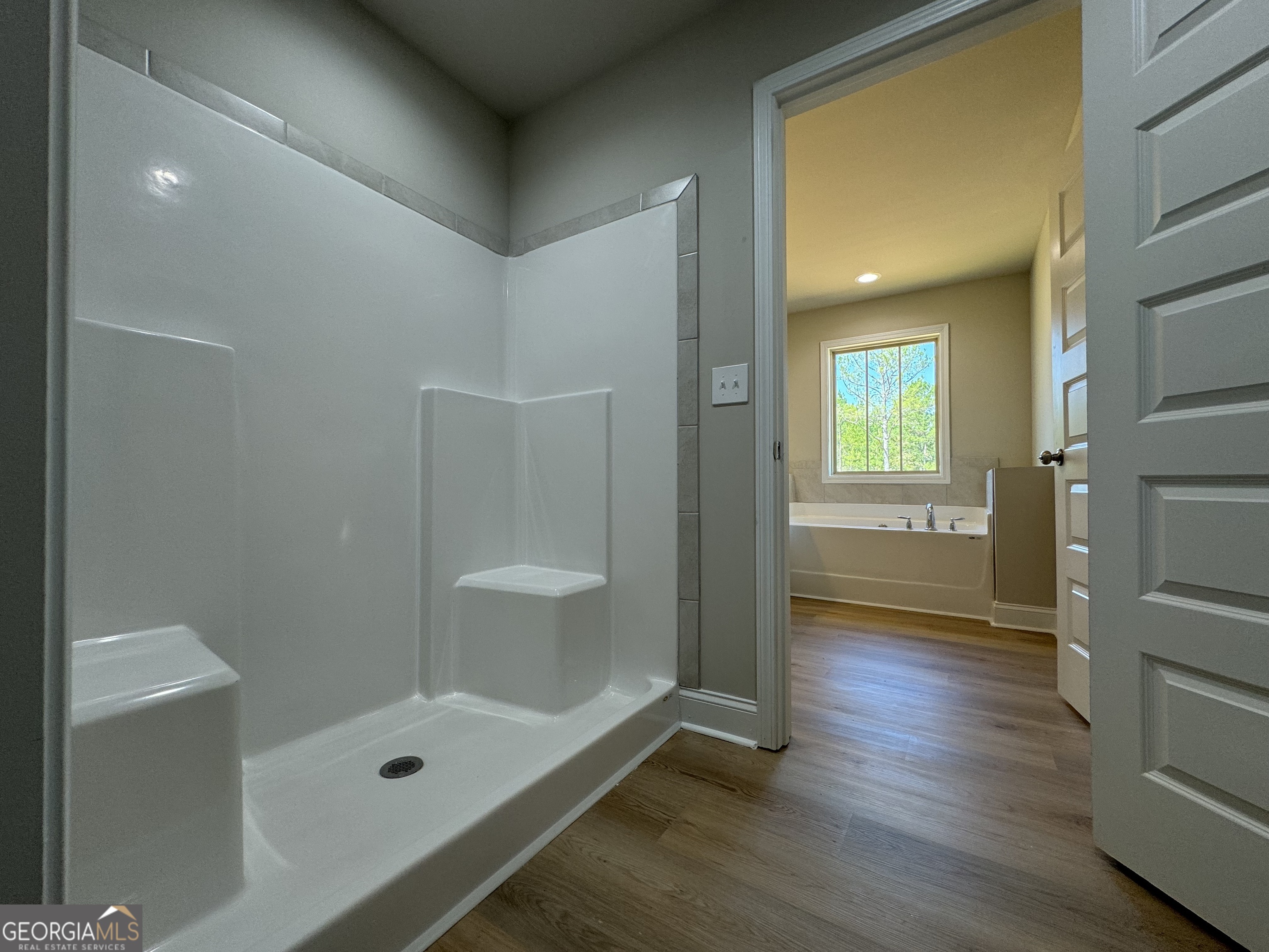 166 Country World Drive Macon, GA 31211 - Photo 9 of 33 a bathroom with a tub and shower
