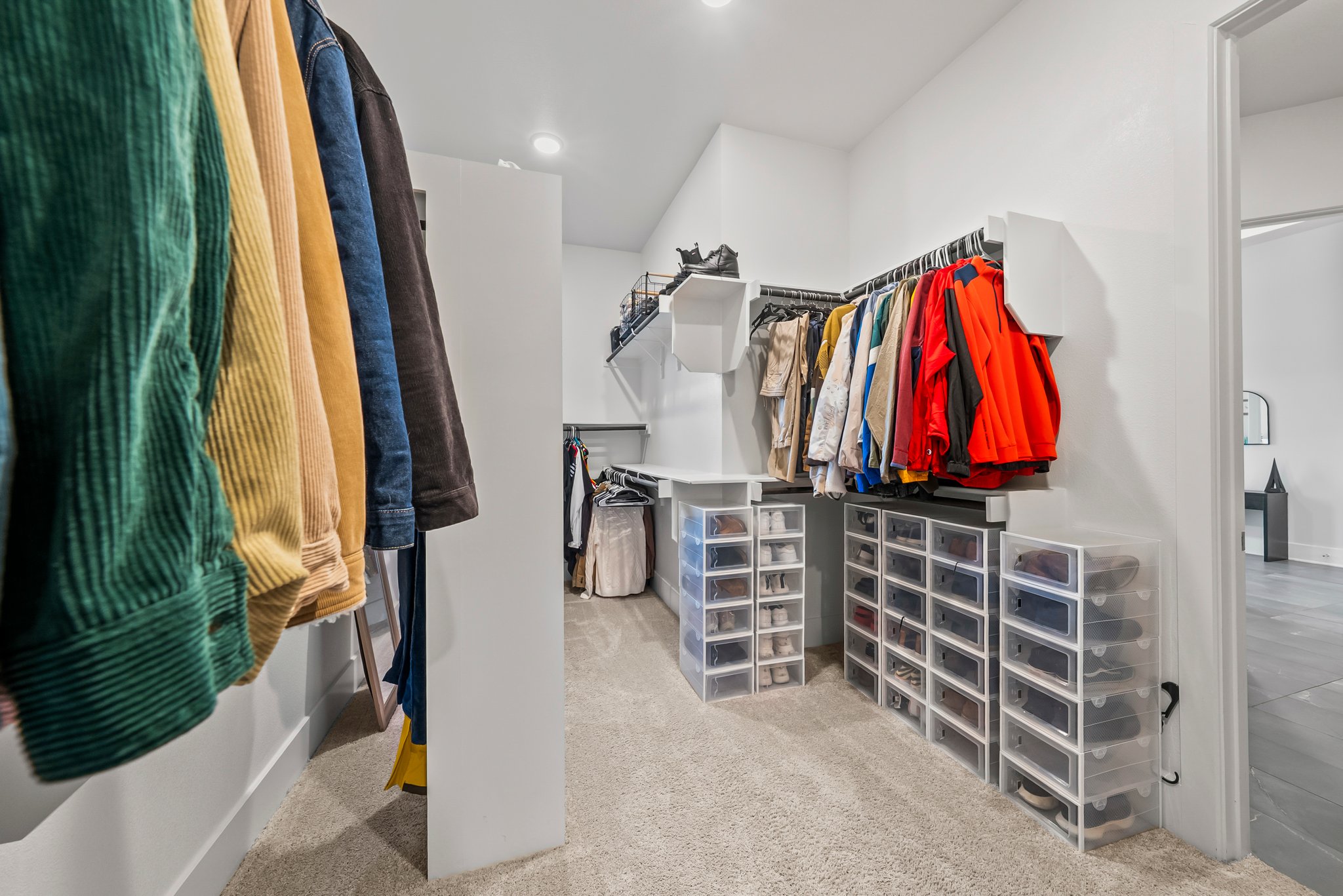 124 Low River Lane Georgetown, TX 78628 - Photo 21 of 38 a view of walk in closet with clothes and shoes