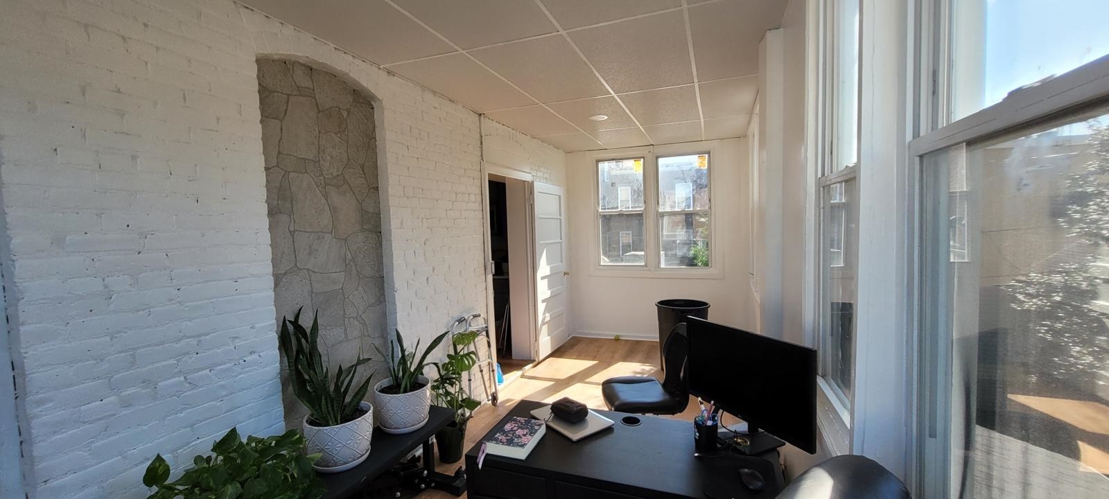 69 Poplar Street Jersey City, NJ 07307 - Photo 13 of 13 a view of a workspace with furniture and a window