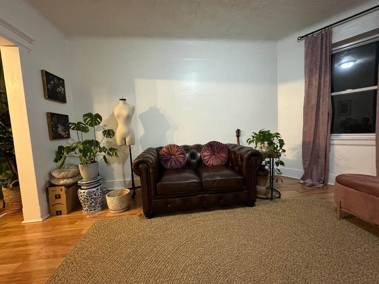 69 Poplar Street Jersey City, NJ 07307 - Photo 4 of 13 a living room with furniture and a flat screen tv