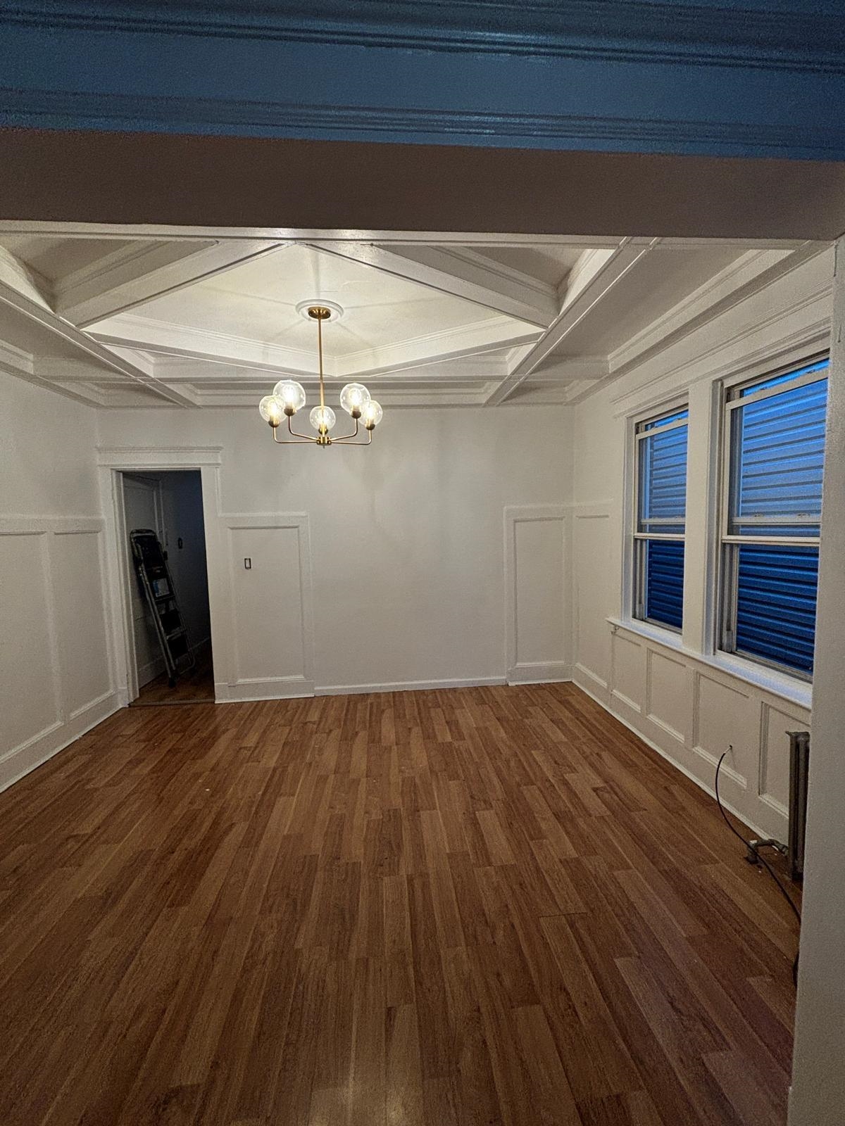69 Poplar Street Jersey City, NJ 07307 - Photo 5 of 13 a view of empty room with wooden floor and fan