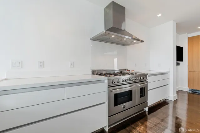 a kitchen with a stove and a sink