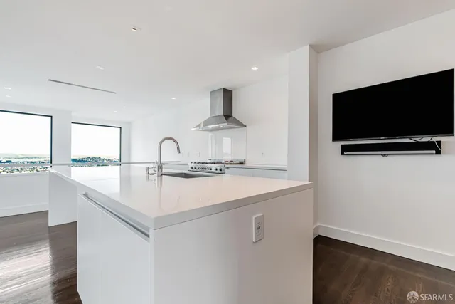 a view of a kitchen with a sink and a dishwasher